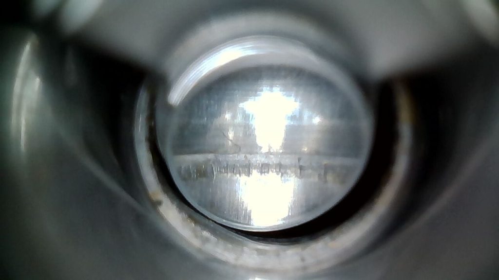 Borescope image showing where a carbon ring used to be in a barrel that has been cleaned.