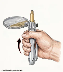 A hand priming tool pushing a primer into a case