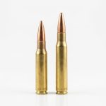 A 308 Winchester cartridge next to a 30-06 Springfield cartridge.
